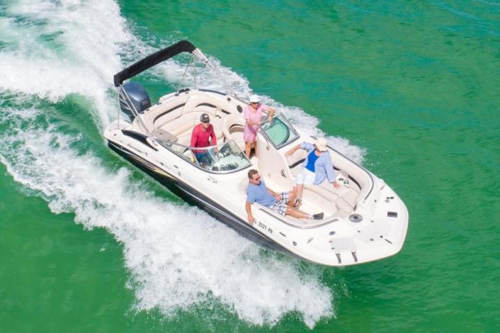 a group of people on a boat in a body of water