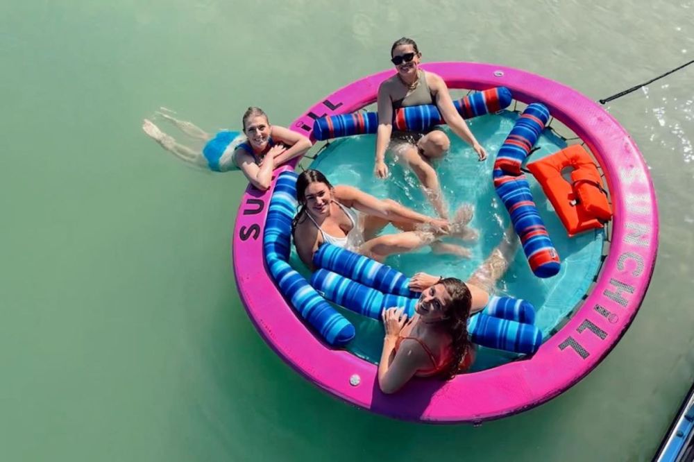 group of girls sit in a sunchill water float in dunedin florida